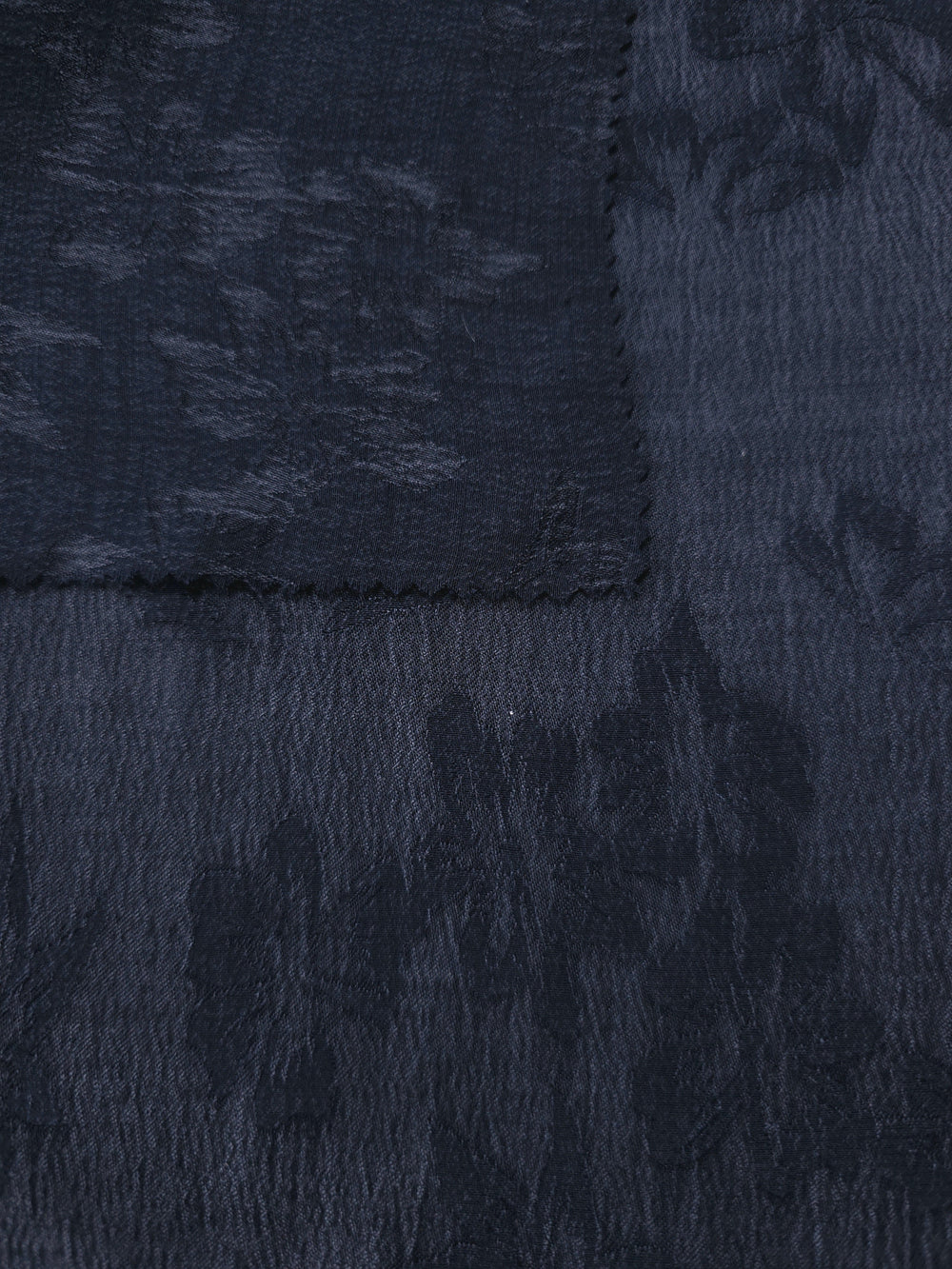 Blue botanical lyocell viscose jacquard showing woven floral texture for HIBA Fabrics comparison of lyocell and viscose jacquard fabrics.
