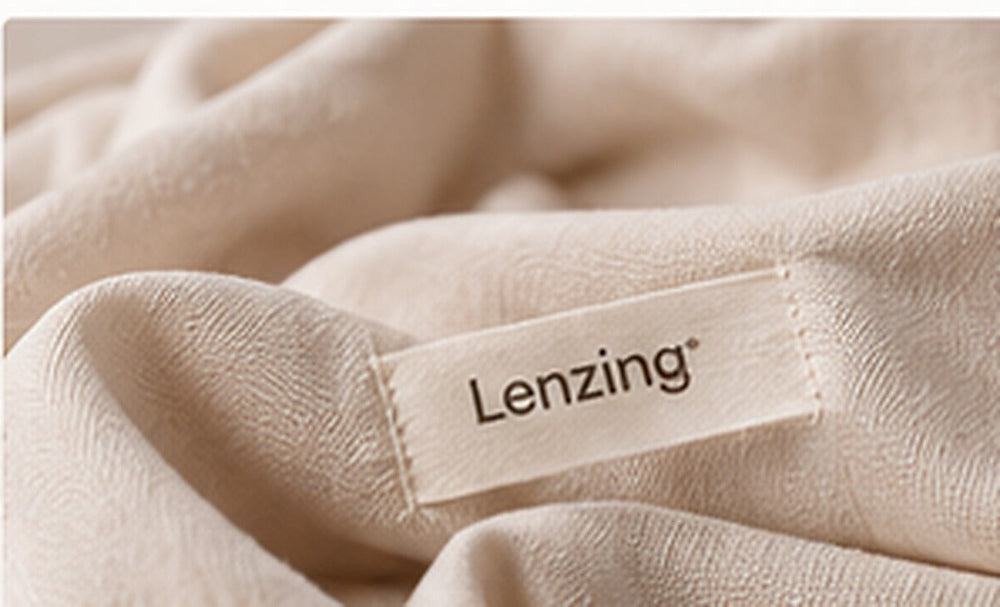 Soft lyocell-style fabric with a Lenzing label for HIBA Fabrics editorial coverage of Lenzing Q1 2026.