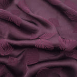 Cherry burgundy botanical leaf print viscose fabric with fluid drape