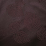 Close-up of warm beige botanical leaf print viscose fabric