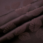 Warm beige botanical leaf print fabric detail showing organic motif