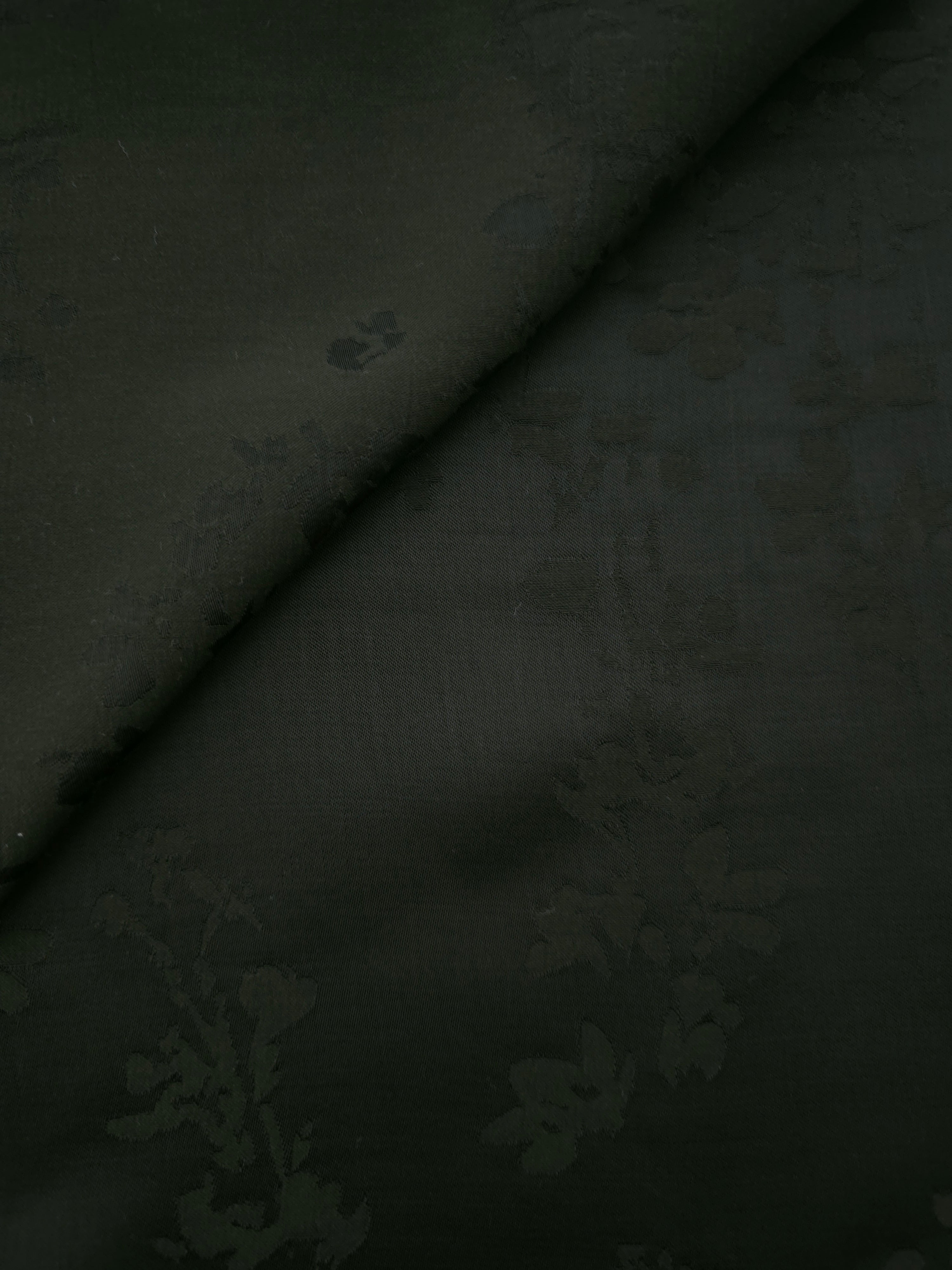 Dark green petal flower print viscose fabric with flowing drape