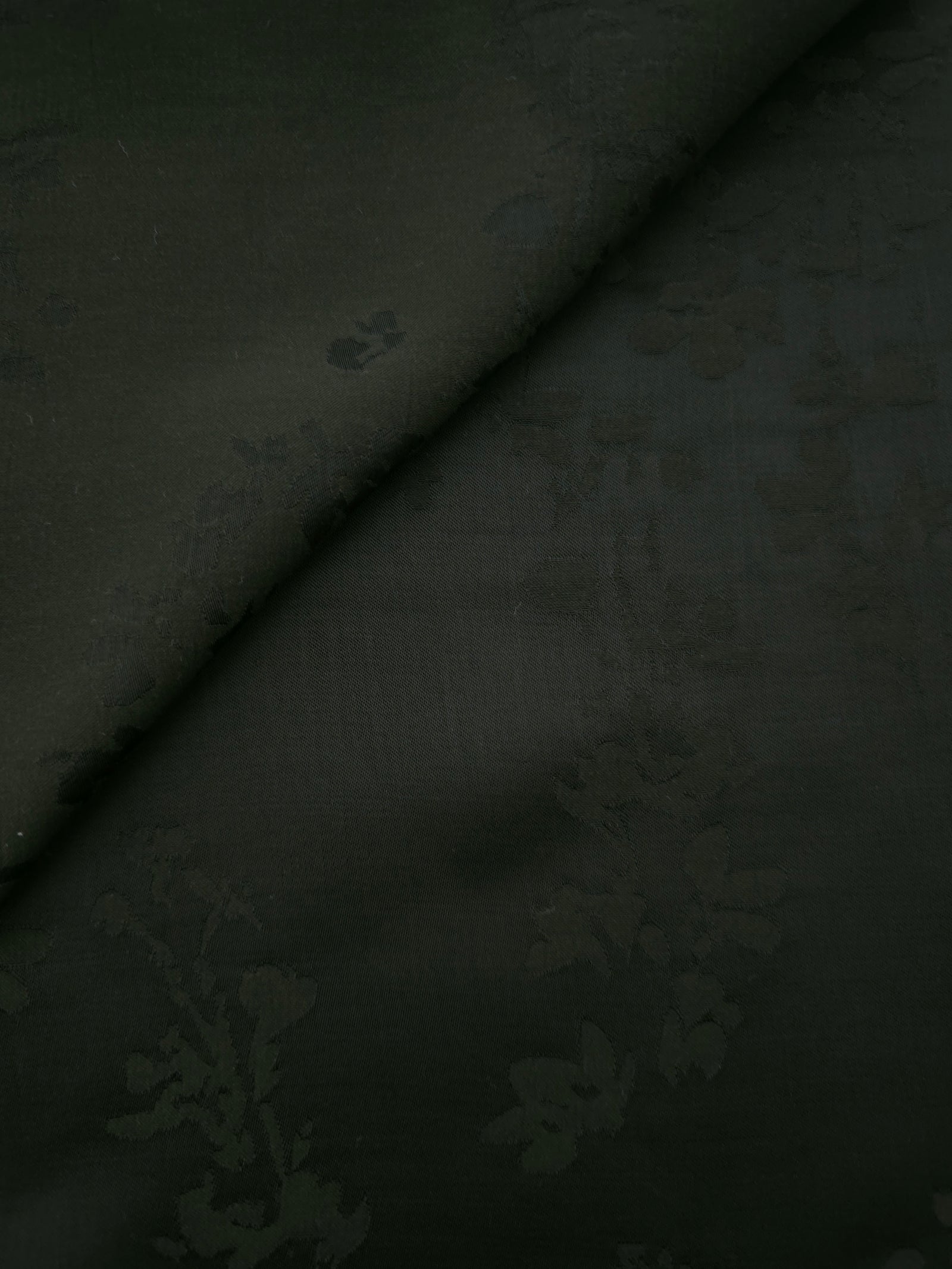 Dark green petal flower print viscose fabric with flowing drape