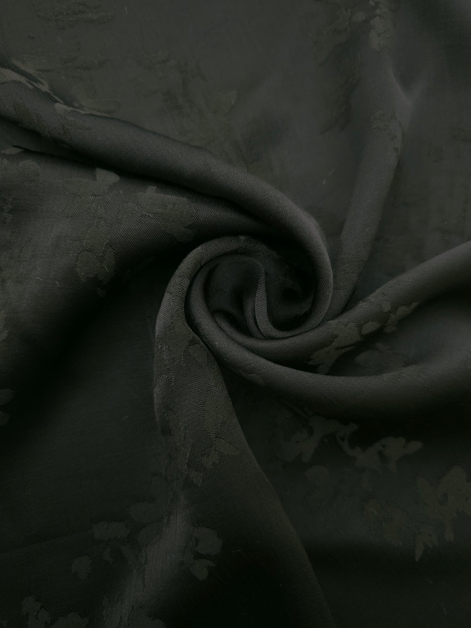 Lightweight dark green petal flower print viscose dressmaking fabric