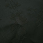 Close-up of dark green petal flower print viscose fabric