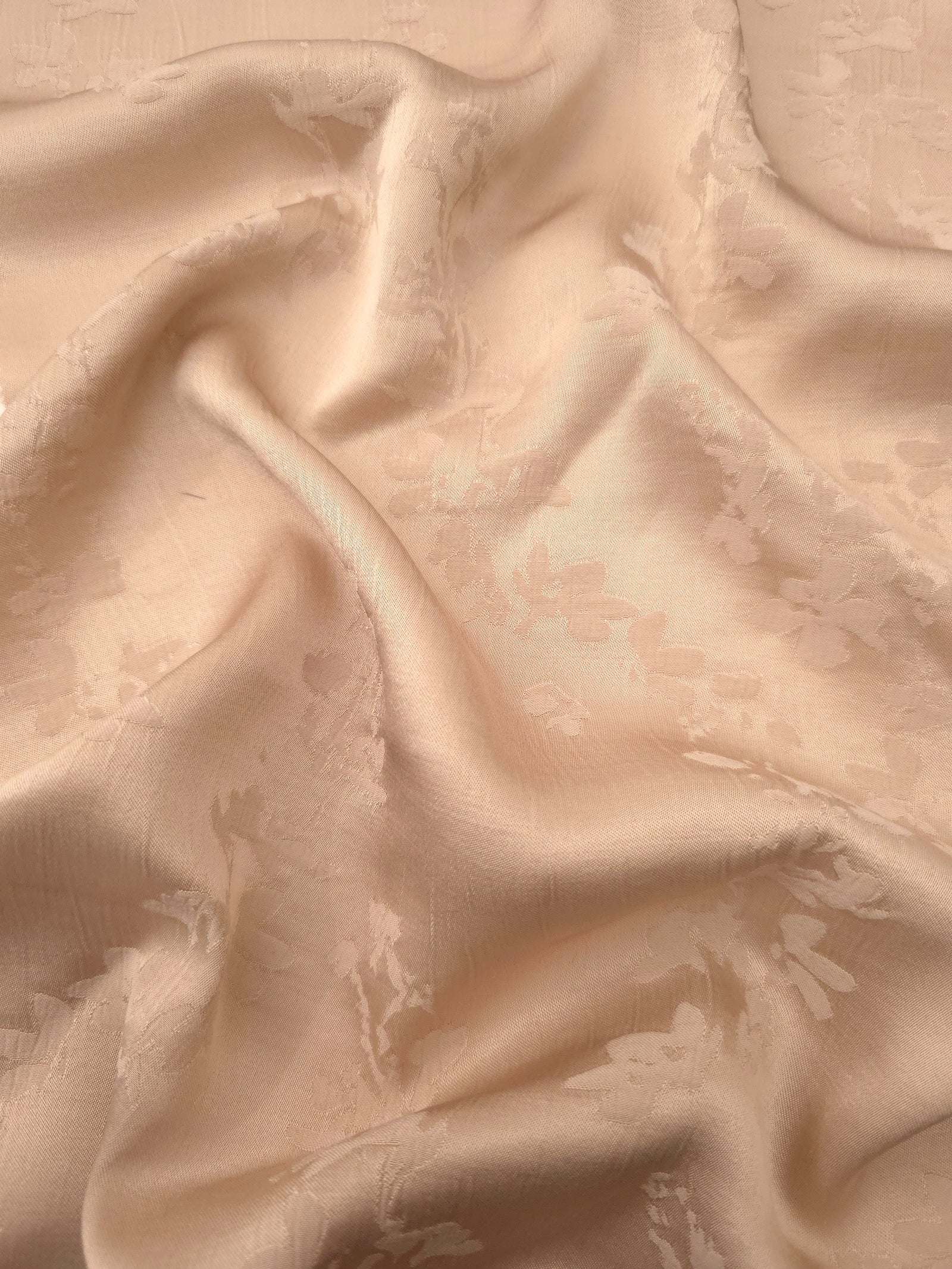Warm beige petal flower print viscose fabric with fluid garment drape