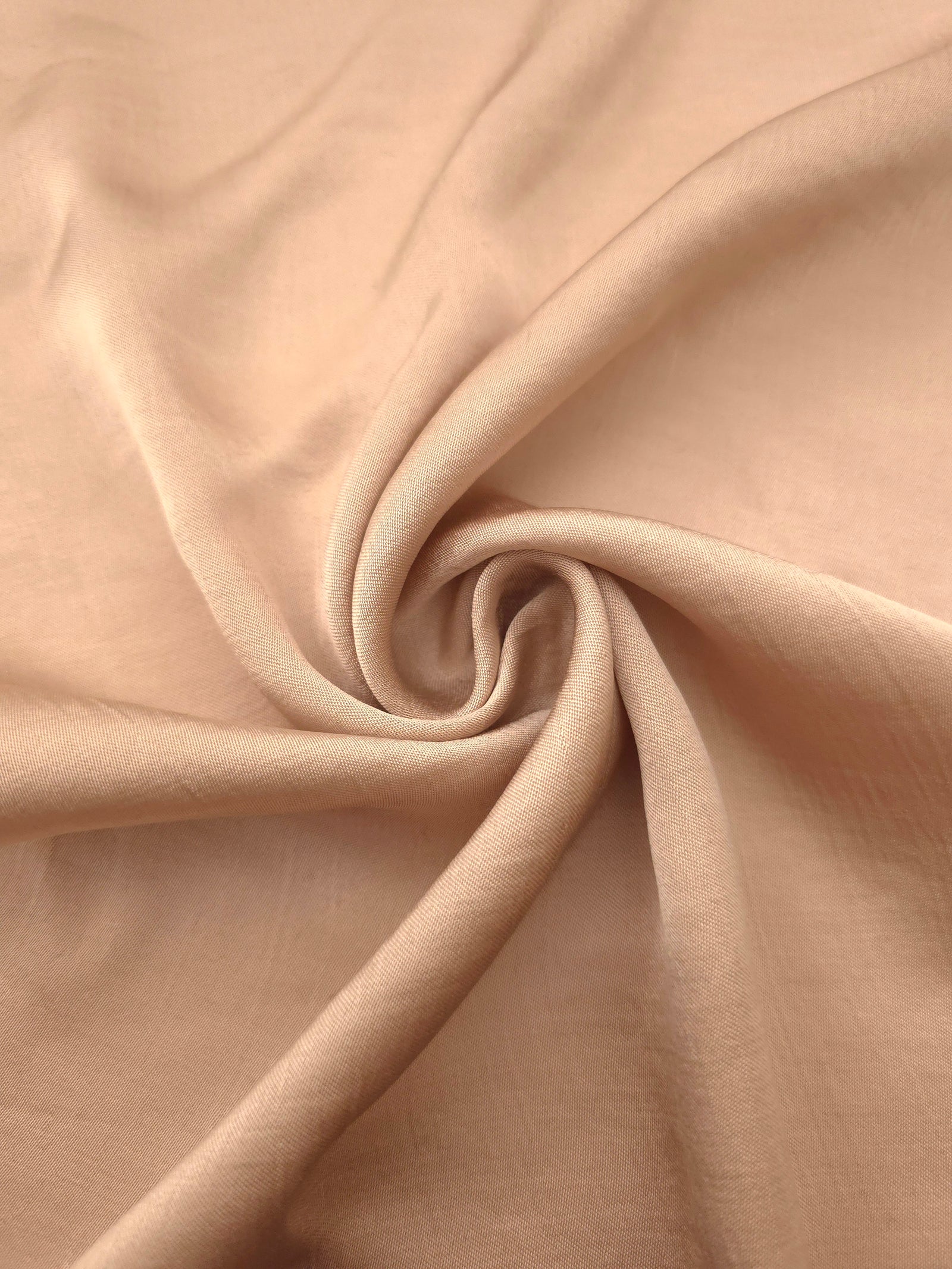 Lightweight warm beige 100% viscose garment fabric for dressmaking