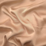 Warm beige plain 100% viscose fabric for modest dresses and flowing apparel