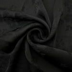 Lightweight black stylized leaf print viscose fabric for dressmaking