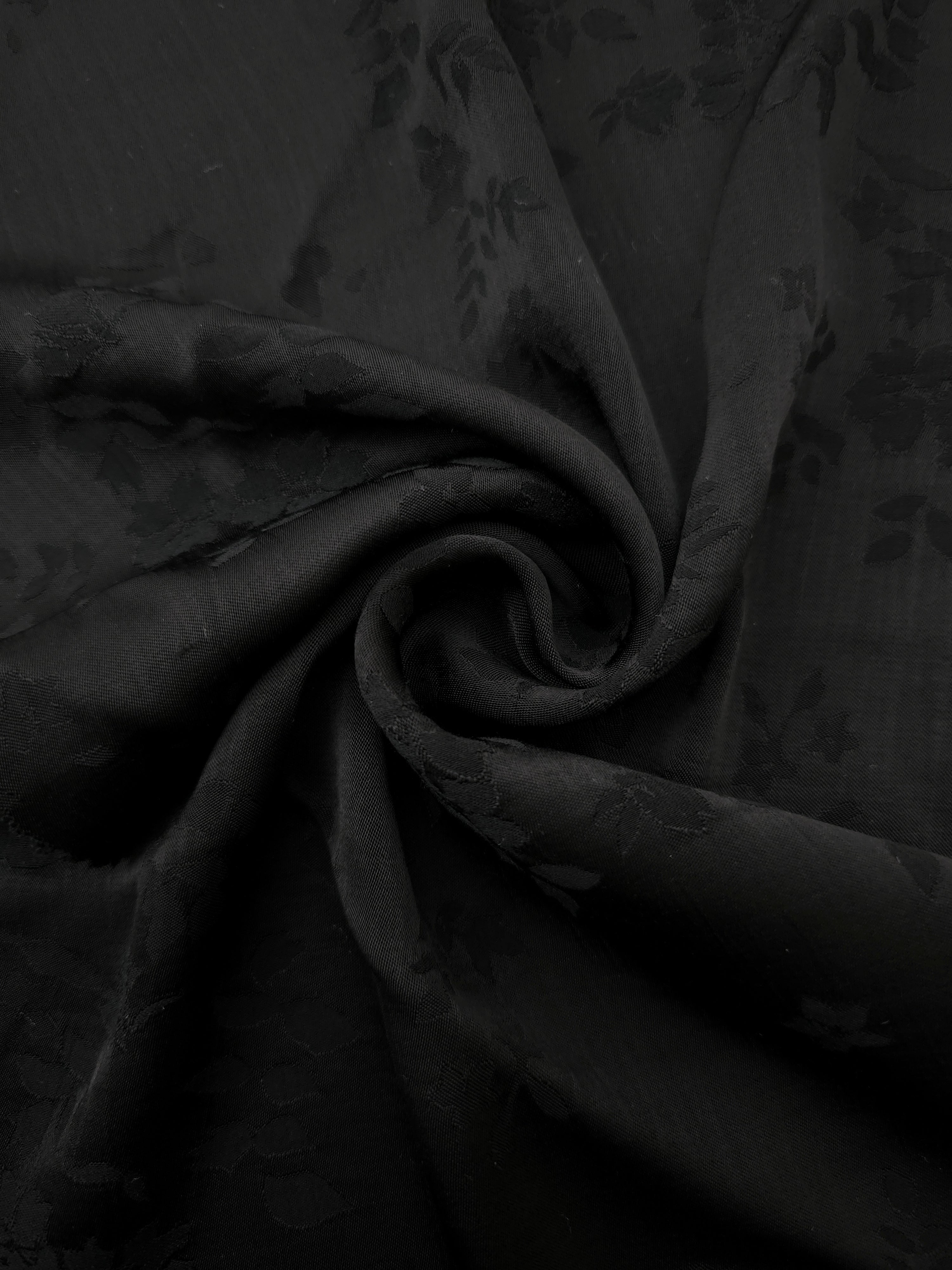 Lightweight black stylized leaf print viscose fabric for dressmaking