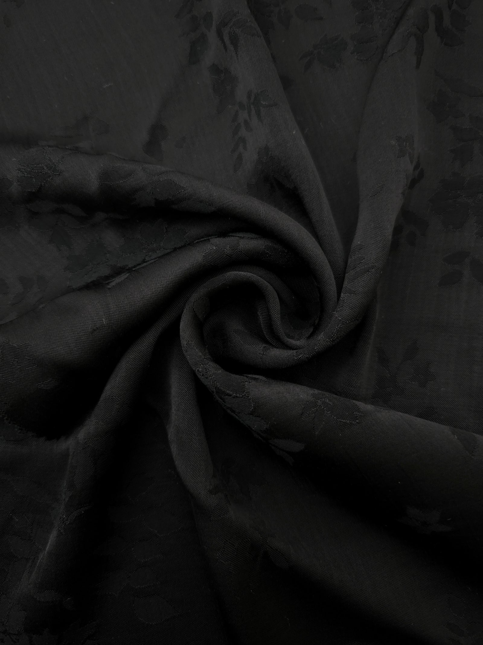 Lightweight black stylized leaf print viscose fabric for dressmaking