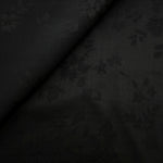Black stylized leaf print viscose fabric for modest dresses and apparel