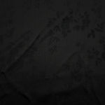 Soft drape black stylized leaf print viscose dress fabric