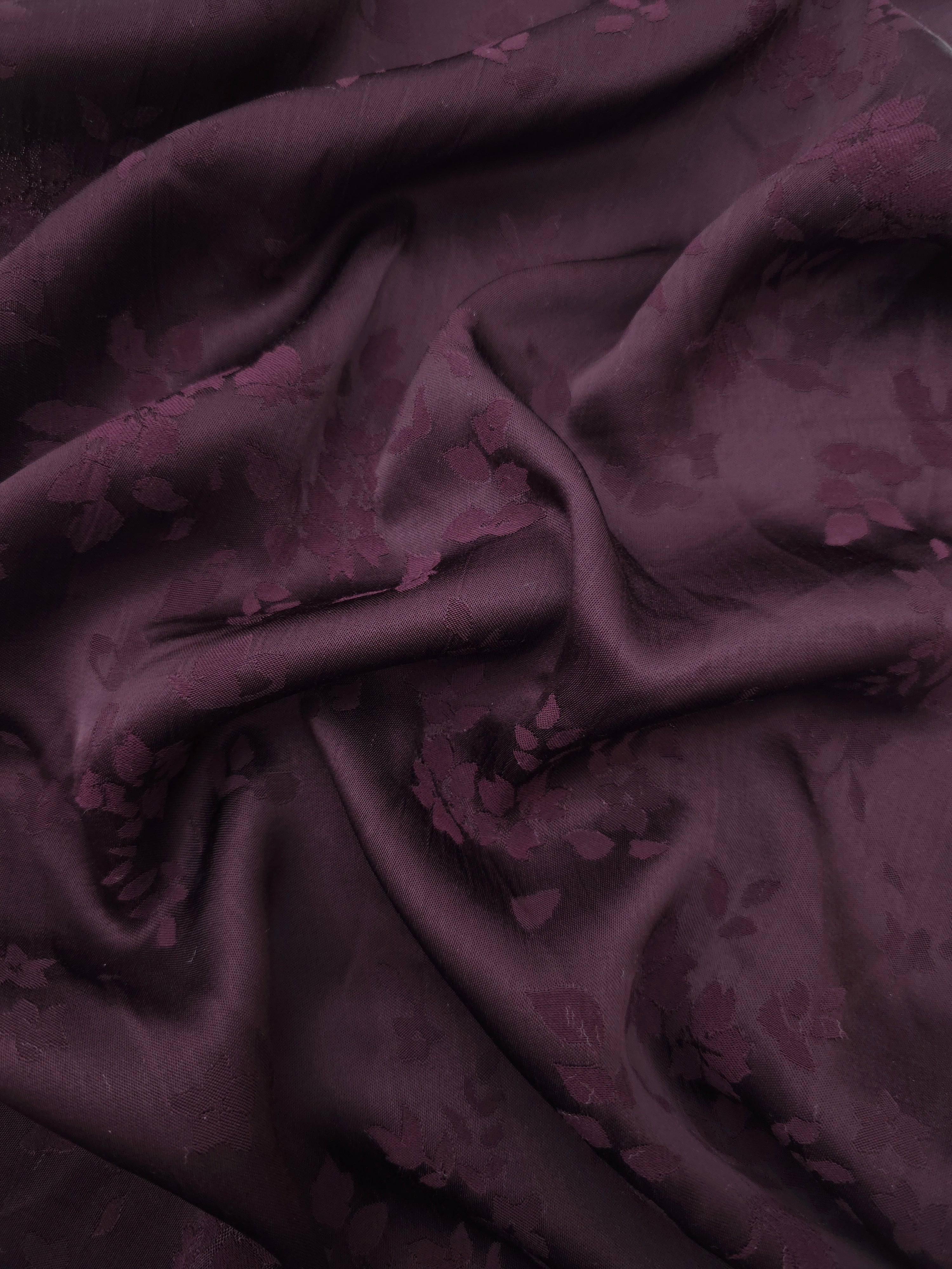 Cherry burgundy stylized leaf print viscose fabric with flowing drape