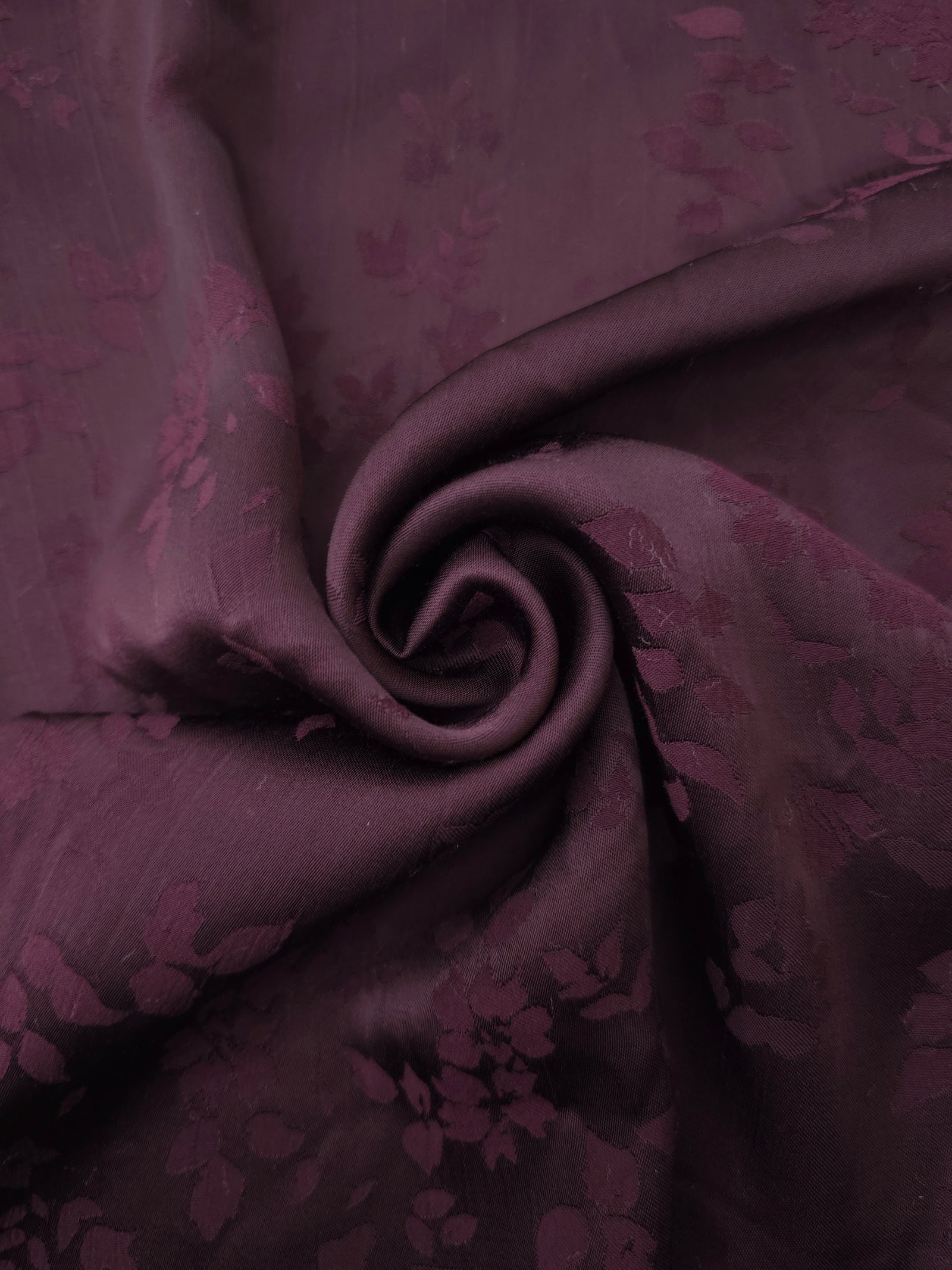 Lightweight cherry burgundy stylized leaf print viscose dressmaking fabric