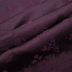 Cherry burgundy stylized leaf print fabric detail showing modern motif