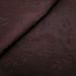 Warm beige stylized leaf print viscose fabric with fluid garment drape