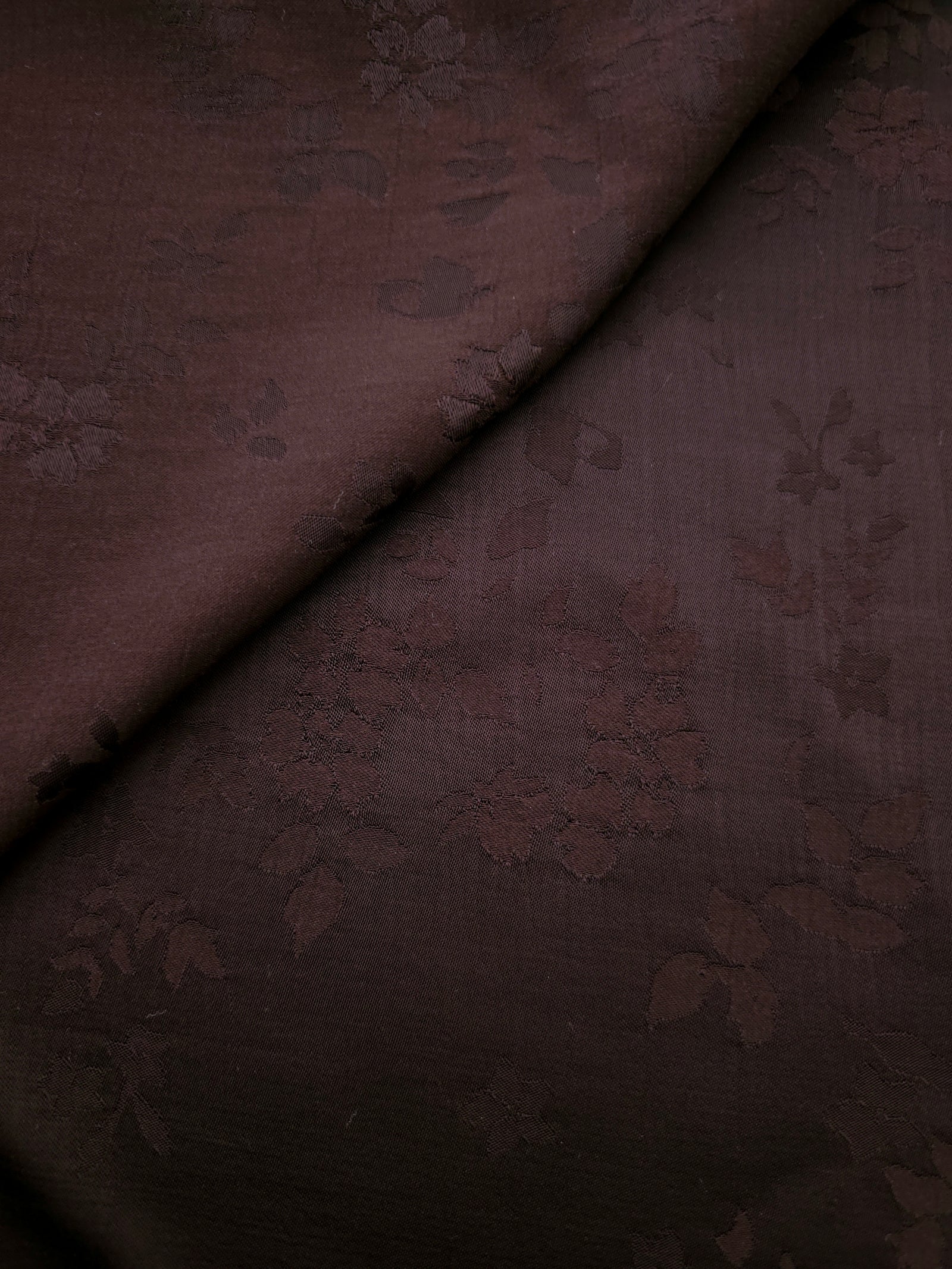 Warm beige stylized leaf print viscose fabric with fluid garment drape