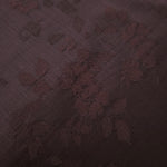 Warm beige stylized leaf print fabric detail showing modern motif