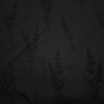 Close-up of black wild tree botanical print on soft 100% viscose fabric