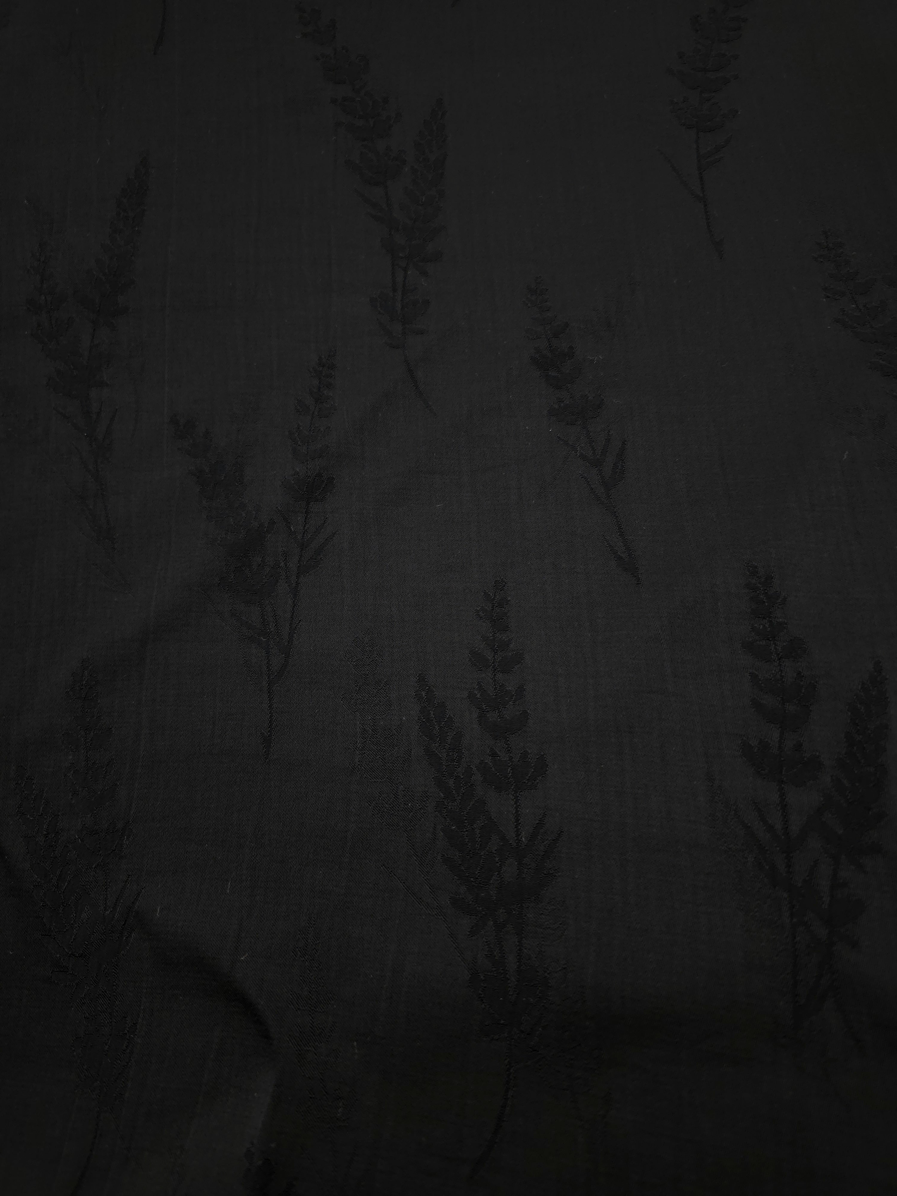 Close-up of black wild tree botanical print on soft 100% viscose fabric