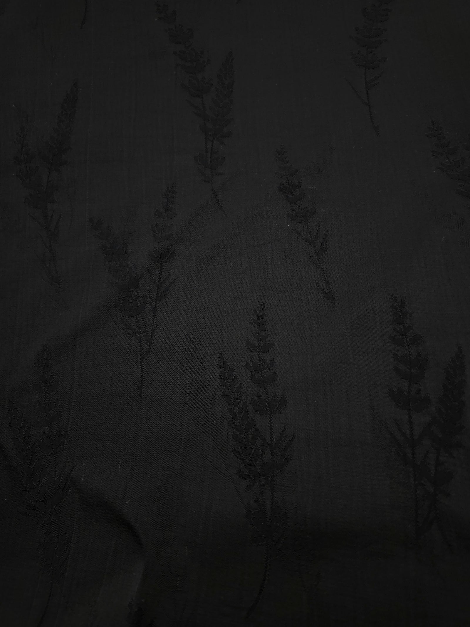 Close-up of black wild tree botanical print on soft 100% viscose fabric