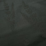 Close-up of dark green wild tree botanical print viscose fabric