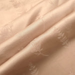 Warm beige wild tree print fabric detail showing botanical pattern