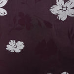 Close view of viscose embossed two-tone jacquard with raised texture for dresses.
