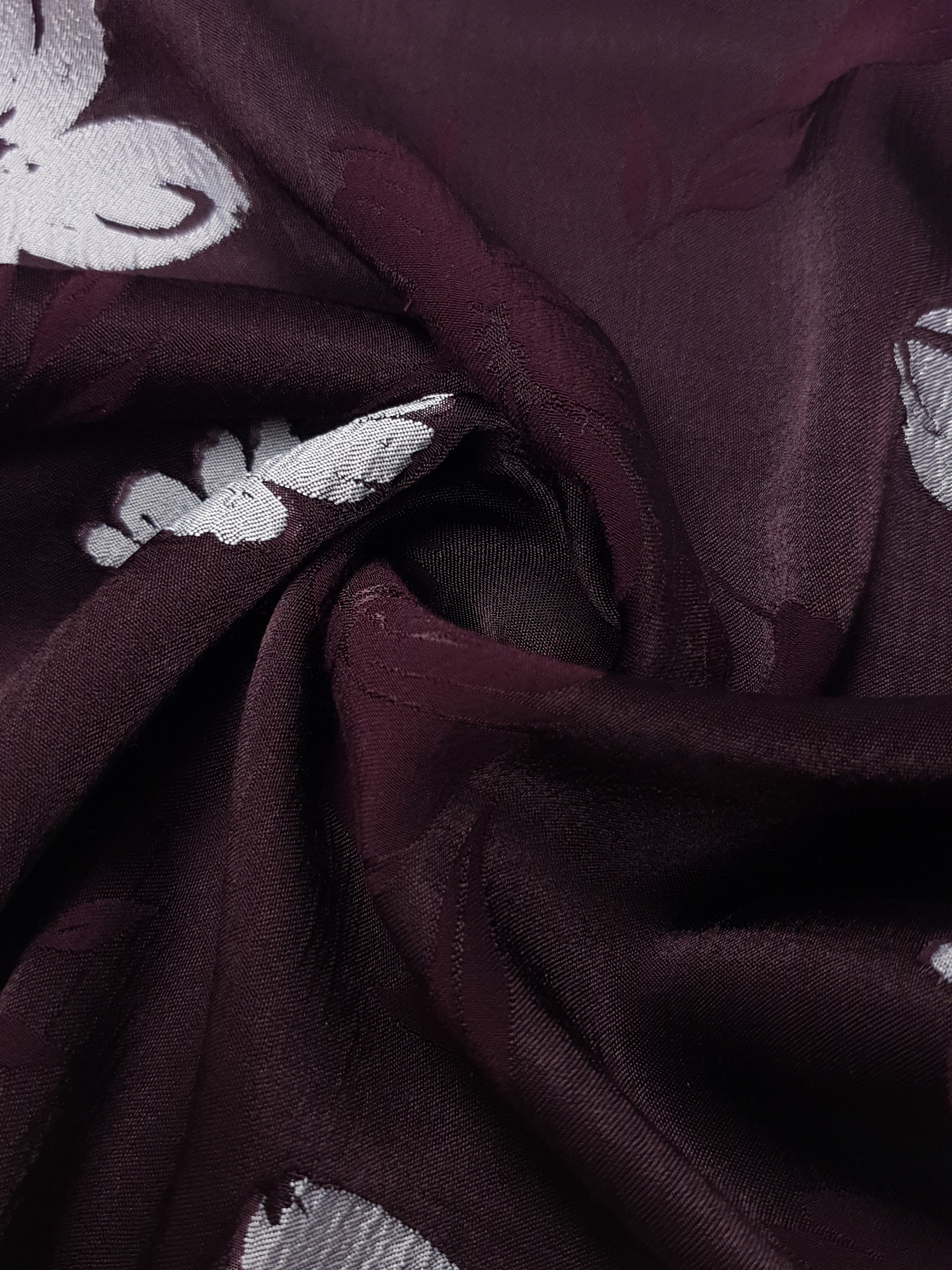Draped viscose embossed jacquard showing soft movement for blouses and skirts.