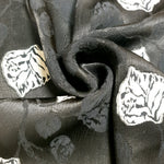 Drape shot of viscose embossed jacquard with structured flow for dresses.