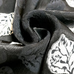 Design detail of woven jacquard with two-tone embossed surface.
