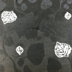 Draped rayon viscose jacquard showing fluid movement and raised pattern.