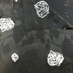 Two-tone jacquard close-up for dresses, overlays and boutique sewing.