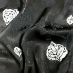 Full view of embossed viscose jacquard fabric for dress and layer planning.