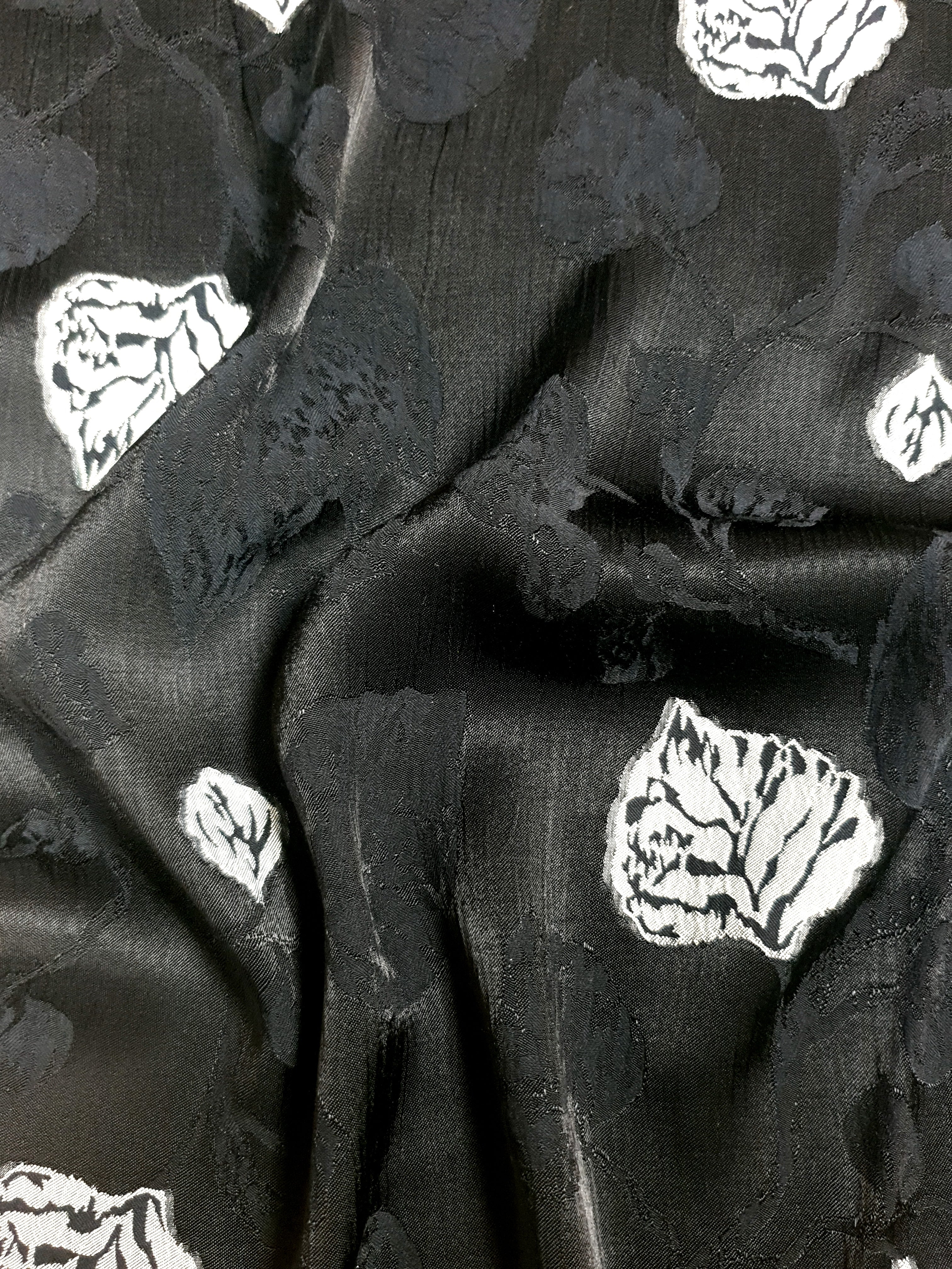 Full view of embossed viscose jacquard fabric for dress and layer planning.