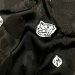Surface close-up of viscose embossed jacquard with tonal woven texture.