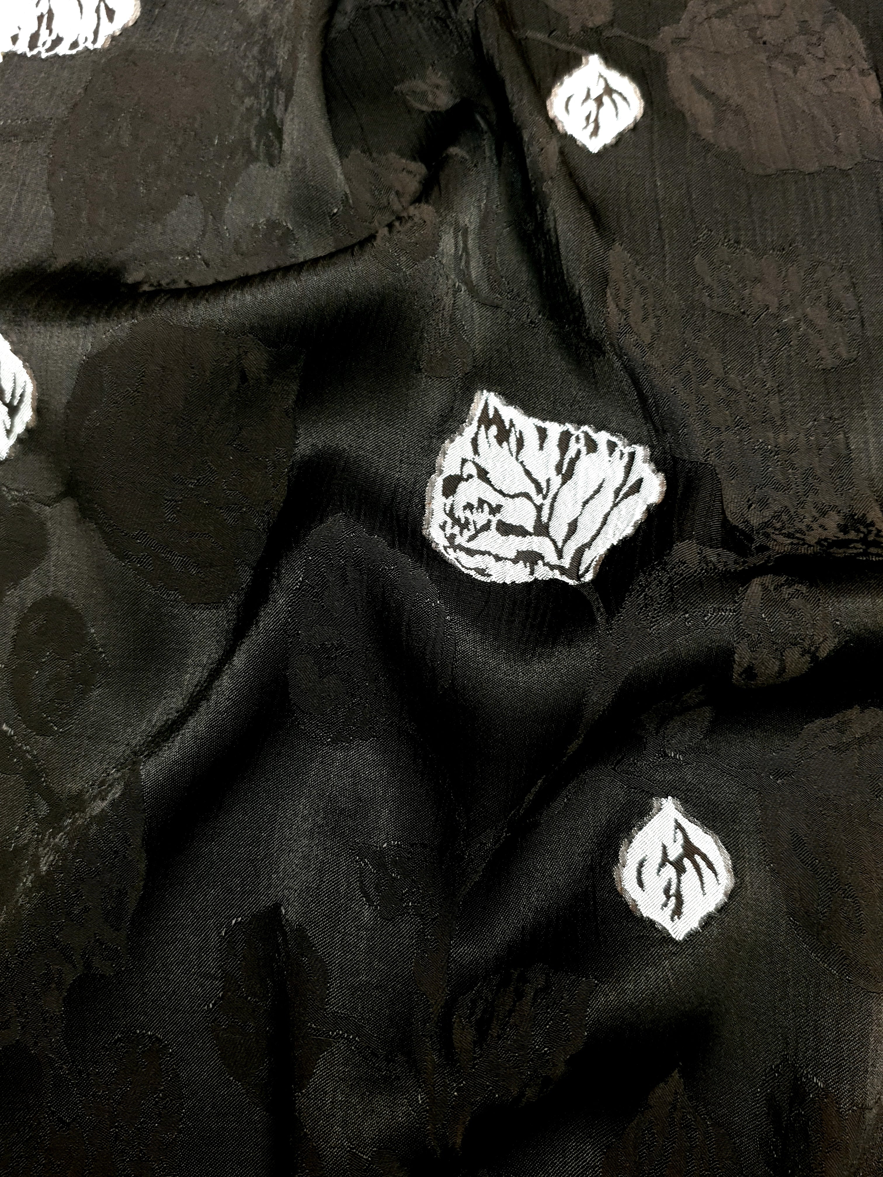 Surface close-up of viscose embossed jacquard with tonal woven texture.