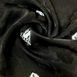 Close drape of two-tone viscose jacquard showing soft woven texture.