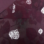 Surface detail of embossed jacquard showing raised woven pattern.