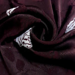 Close view of viscose jacquard with raised leaf texture for garments.