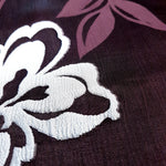 Close detail of rayon viscose jacquard with textured two-tone pattern.