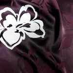 Close drape detail of viscose two-tone jacquard for soft garment layers.