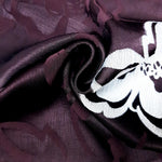 Wave and drape view of viscose jacquard showing soft garment movement.