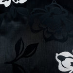Close texture of soft viscose jacquard with raised embossed detail.