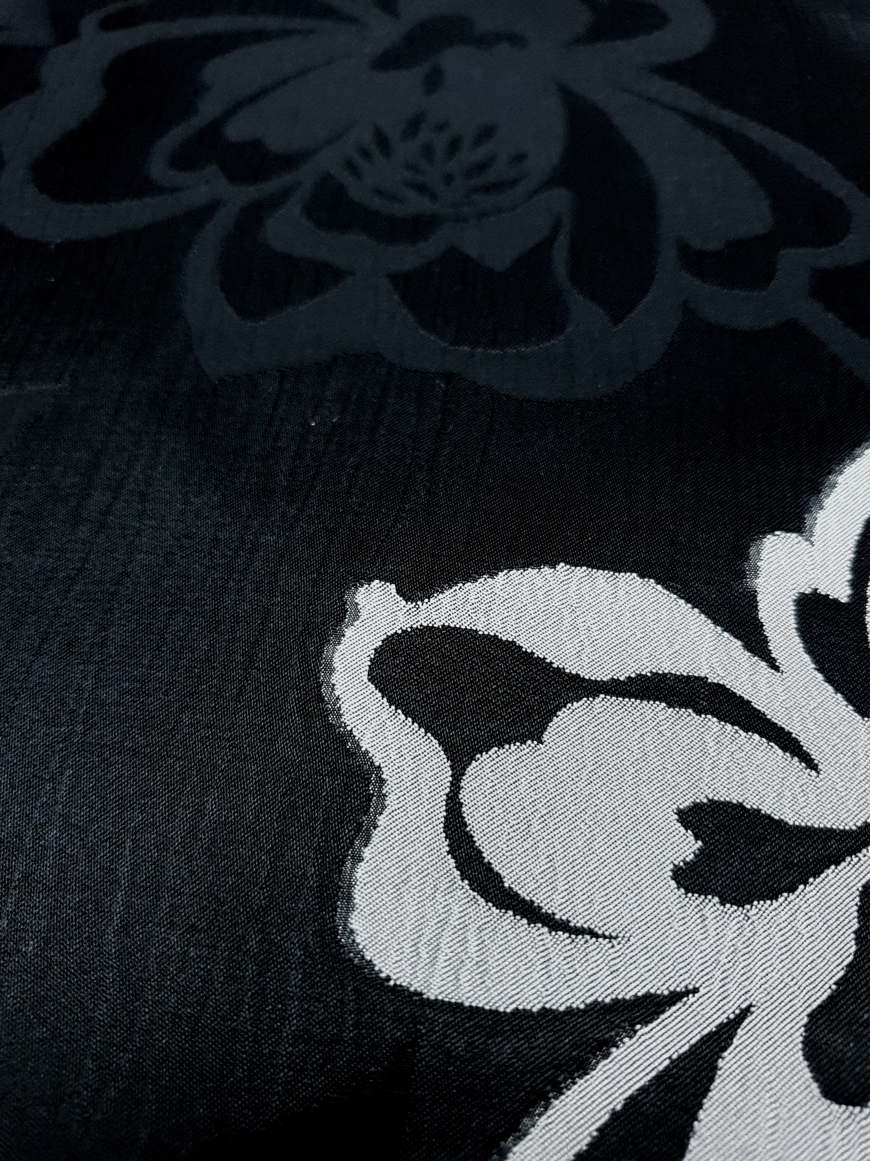 Close texture view of rayon viscose jacquard with embossed two-tone finish.