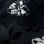 Embossed viscose jacquard design close detail for garment sewing.