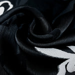 Full view of two-tone woven jacquard fabric for dressmaking.