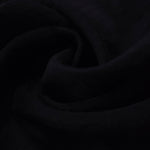 Formal black big leaf embossed viscose jacquard fabric closeup for sheer overlays.