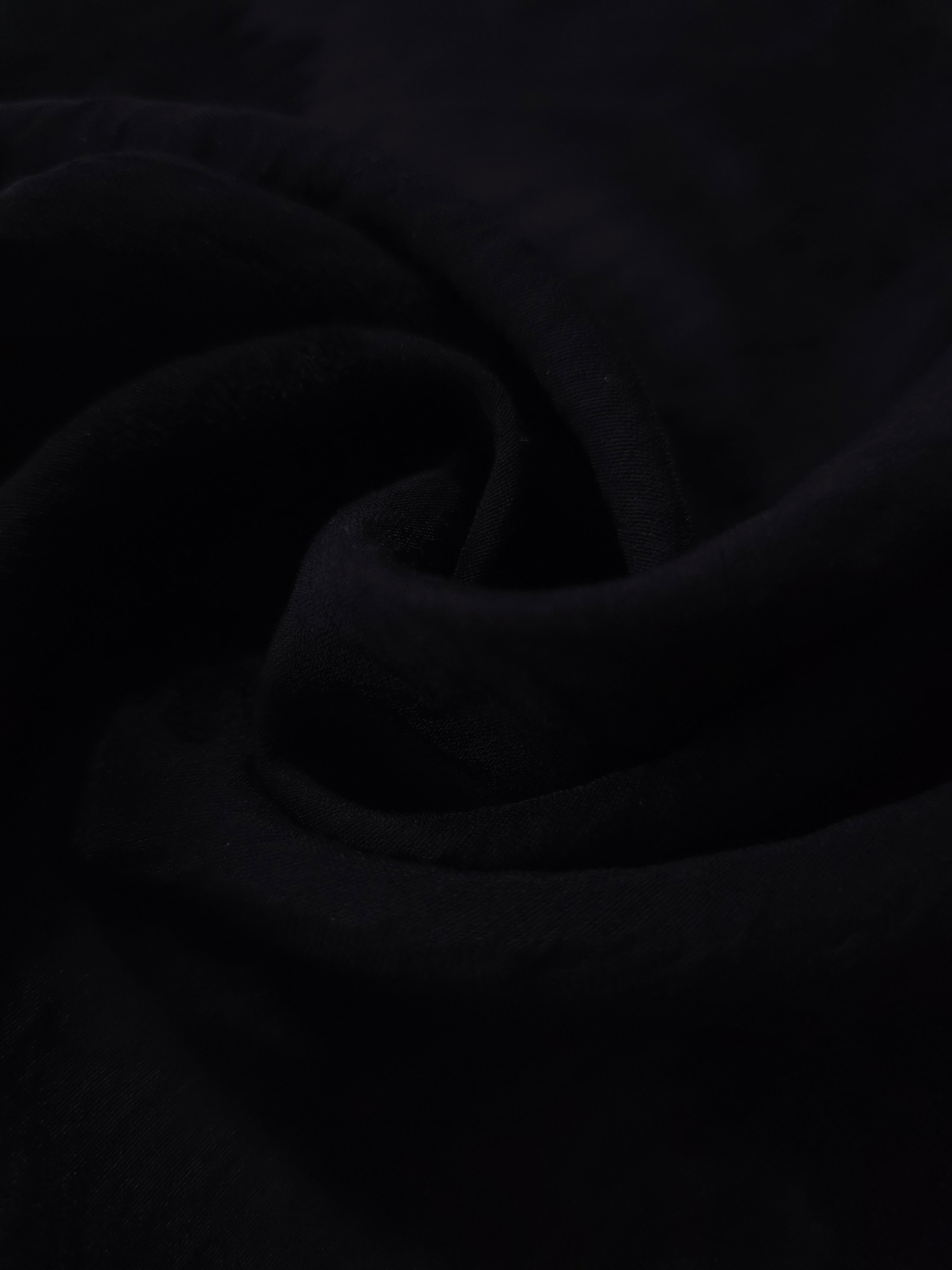 Formal black big leaf embossed viscose jacquard fabric closeup for sheer overlays.
